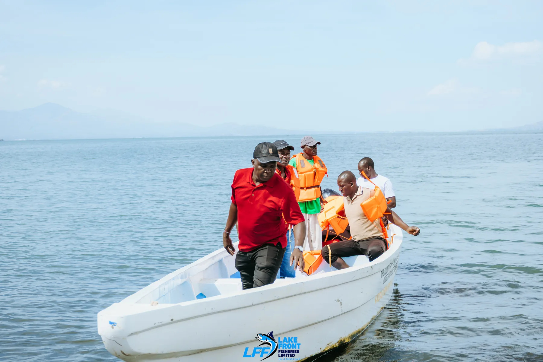 Lake Front Fisheries team arriving by boat on Lake Victoria